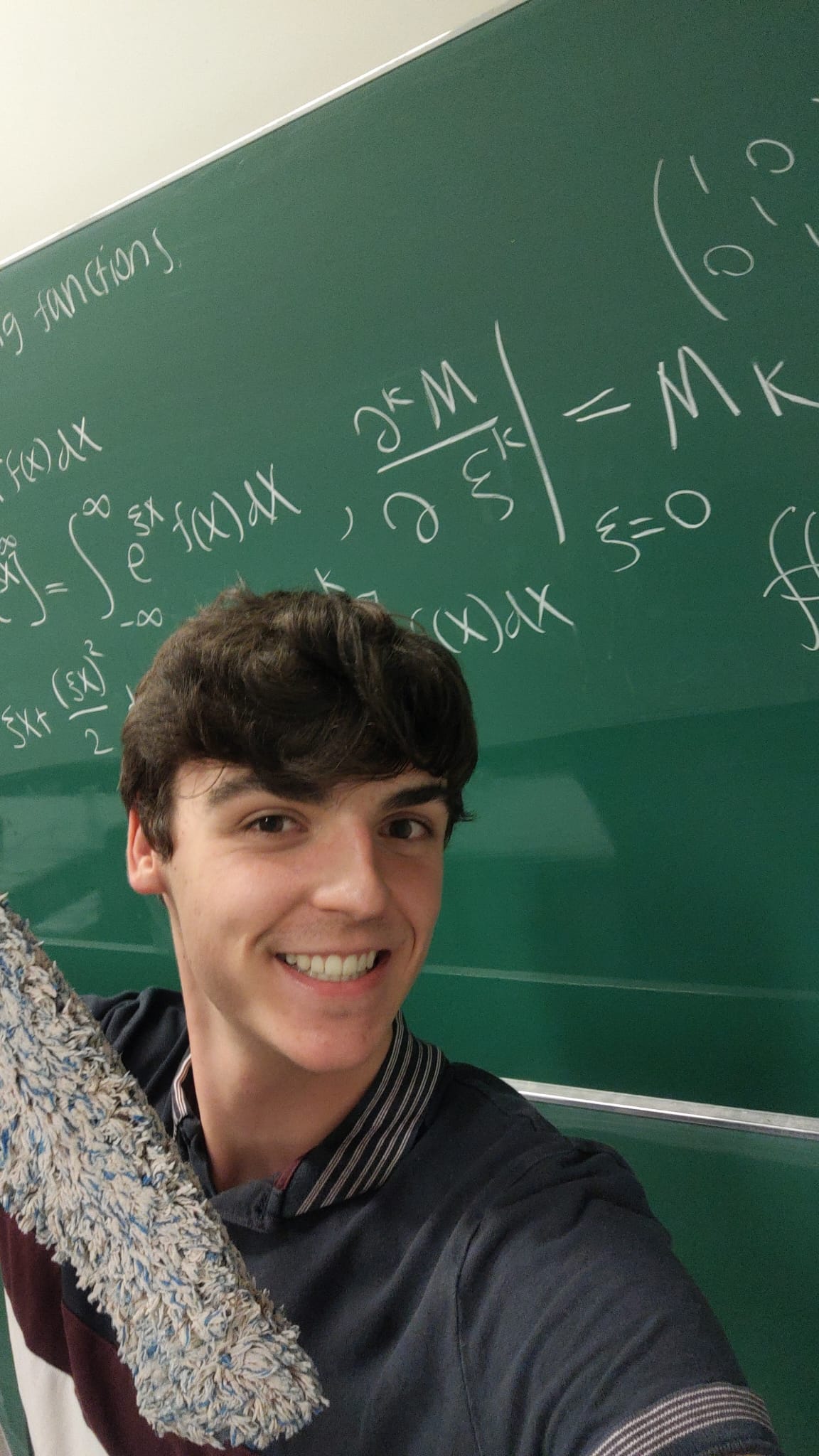 Noah at a chalkboard